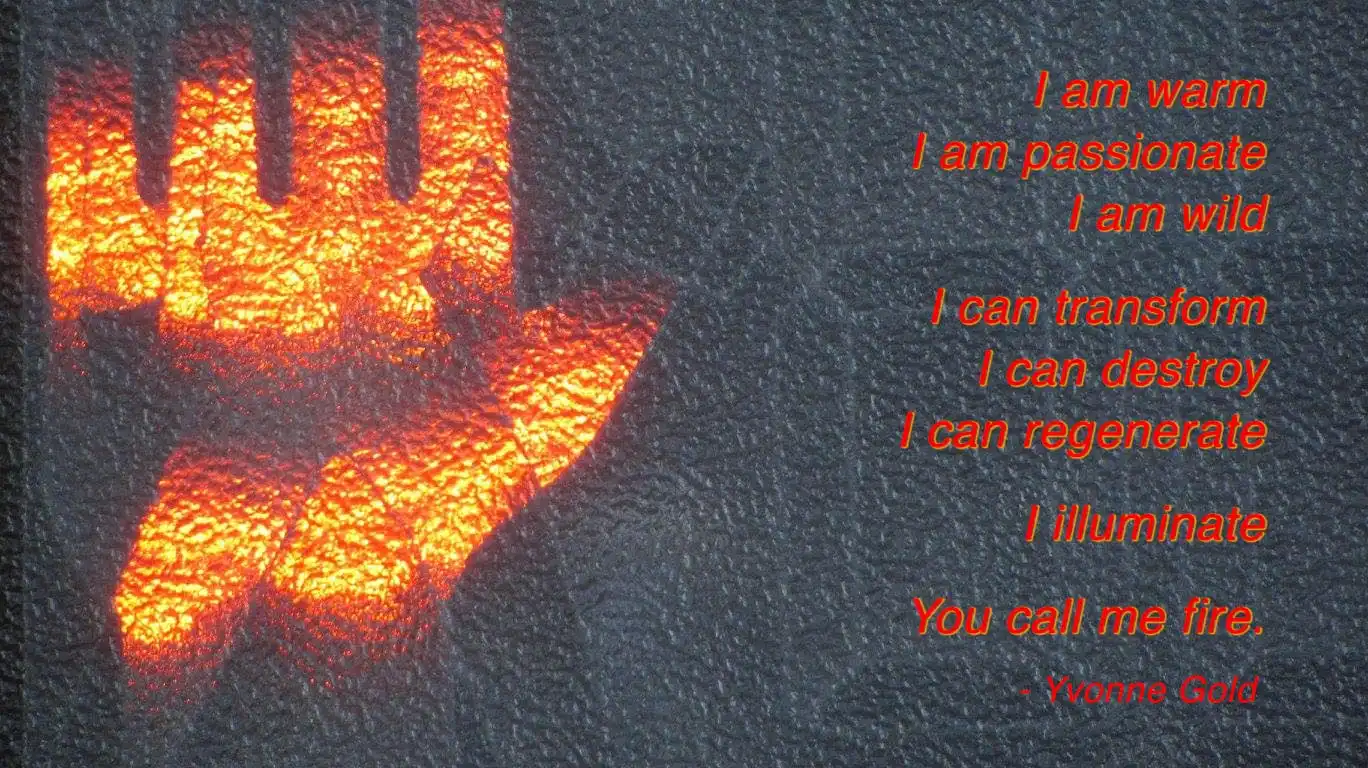 Glowing handprint incscribed with the poem by Yvonne Gold: 'I am warm, I am passionate, I am wild, I can transform, I can destroy, I can regenerate, I illumniate, You call me fire.'