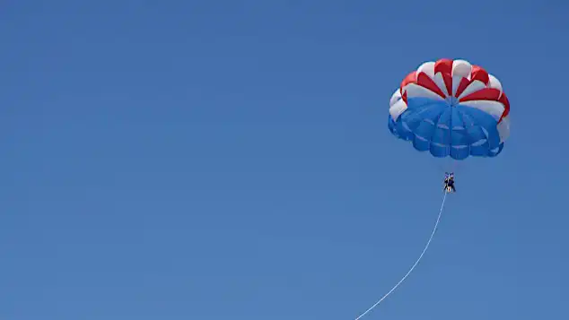 Thumbnail of parasailing on a clear day